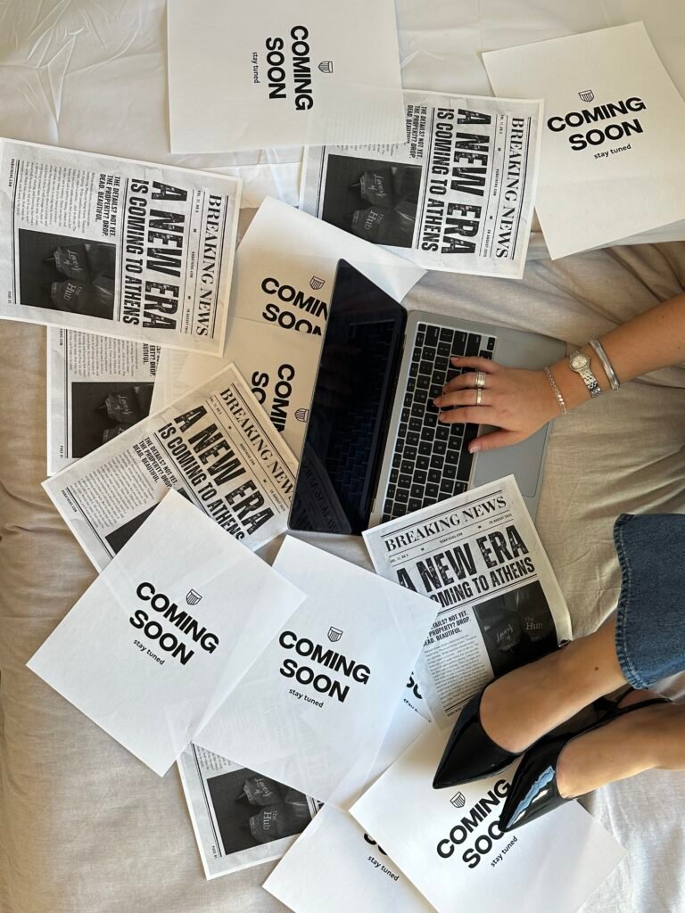 Woman sitting on the floor with her computer, planning hew personal rebranding.