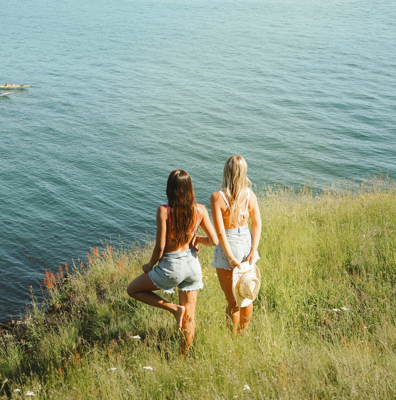 friends enjoying a warm spring day in front of a lake