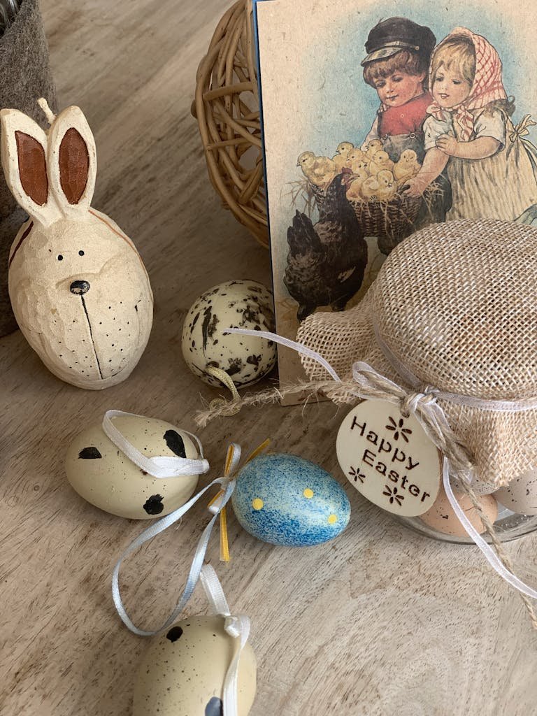 Easter-themed decorations include eggs, bunny, and a vintage card on a wooden surface.