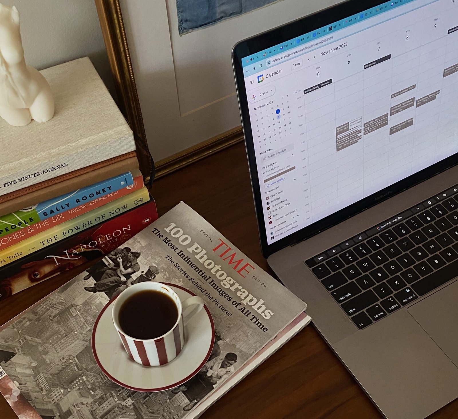 An open laptop featuring a calendar used for monthly planning routine